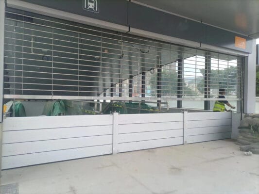 Flood protection at an existing garage or service opening