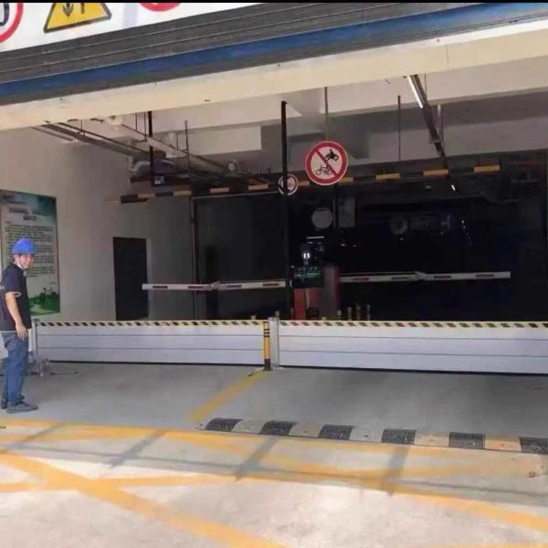 Aluminum flood barrier for storefront entrance in Naples Florida