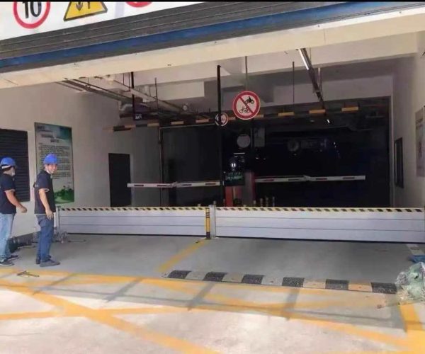 Aluminum flood barriers installed across an underground parking entrance in Clearwater Florida